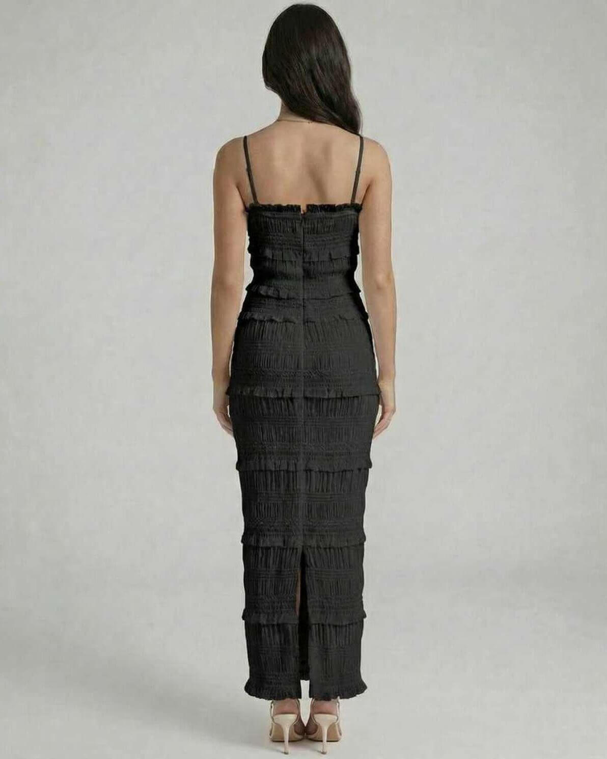 Noir Maxi Dress by Lauven, showcasing the back view with textured pleats and a sleek black design.