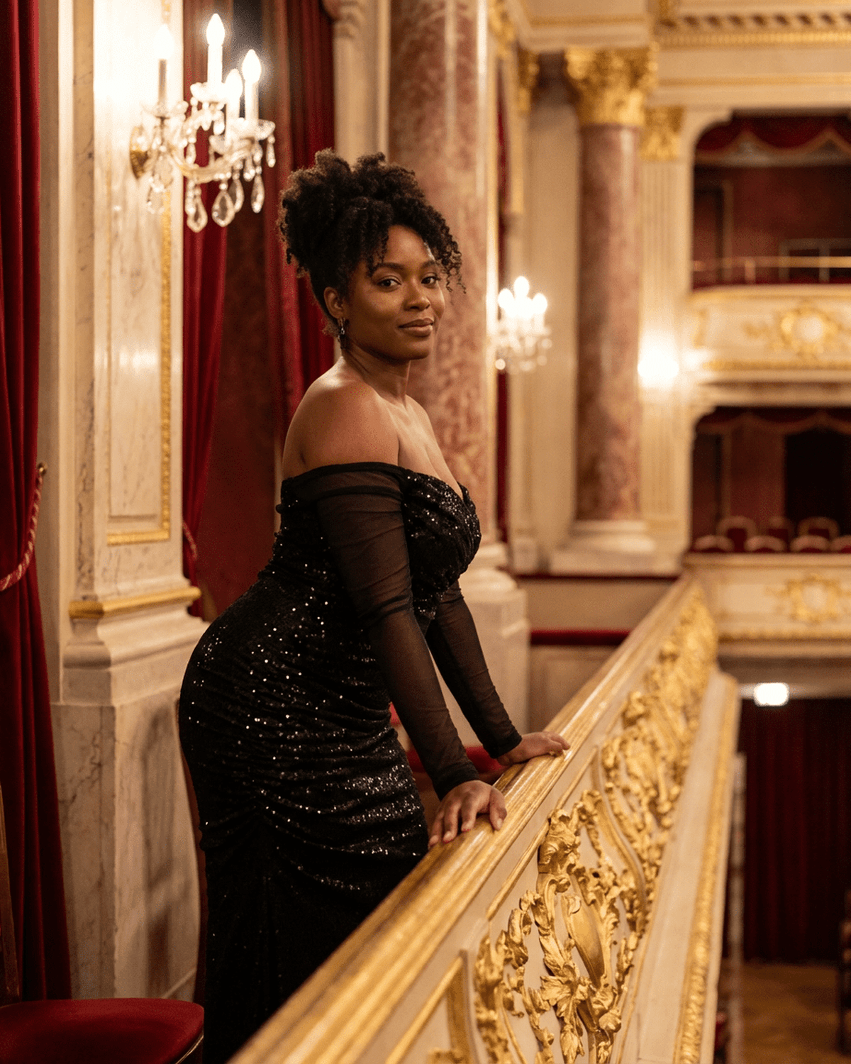 Elegant woman wearing the Noir Maxi Dress by Lauven, showcasing an off-the-shoulder style with sequins.