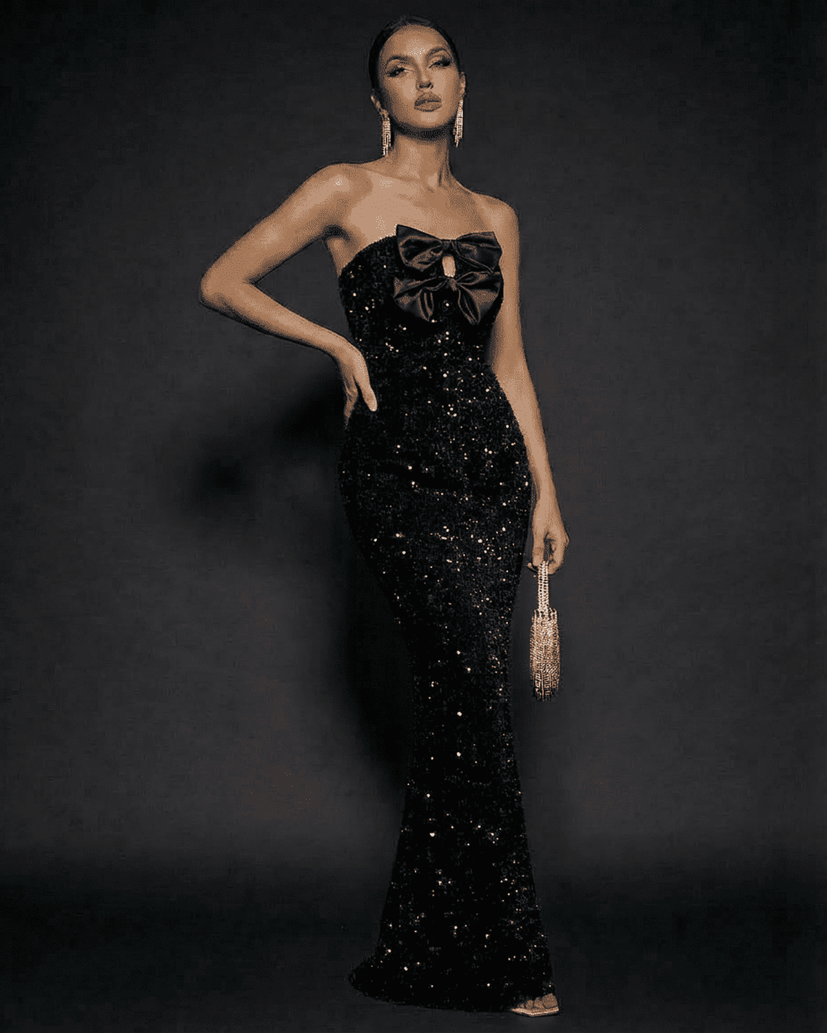 Elegant Noir Maxi Dress by Lauven, featuring sequins, strapless design, and satin bows for a glamorous evening look.