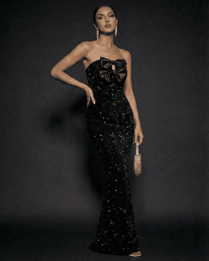 Elegant Noir Maxi Dress by Lauven, featuring sequins, strapless design, and satin bows for a glamorous evening look.
