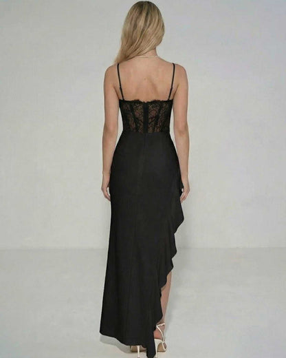 Noir Maxi Dress by Lauven featuring a sheer lace bodice and flowing ruffled asymmetric skirt, shown from the back.