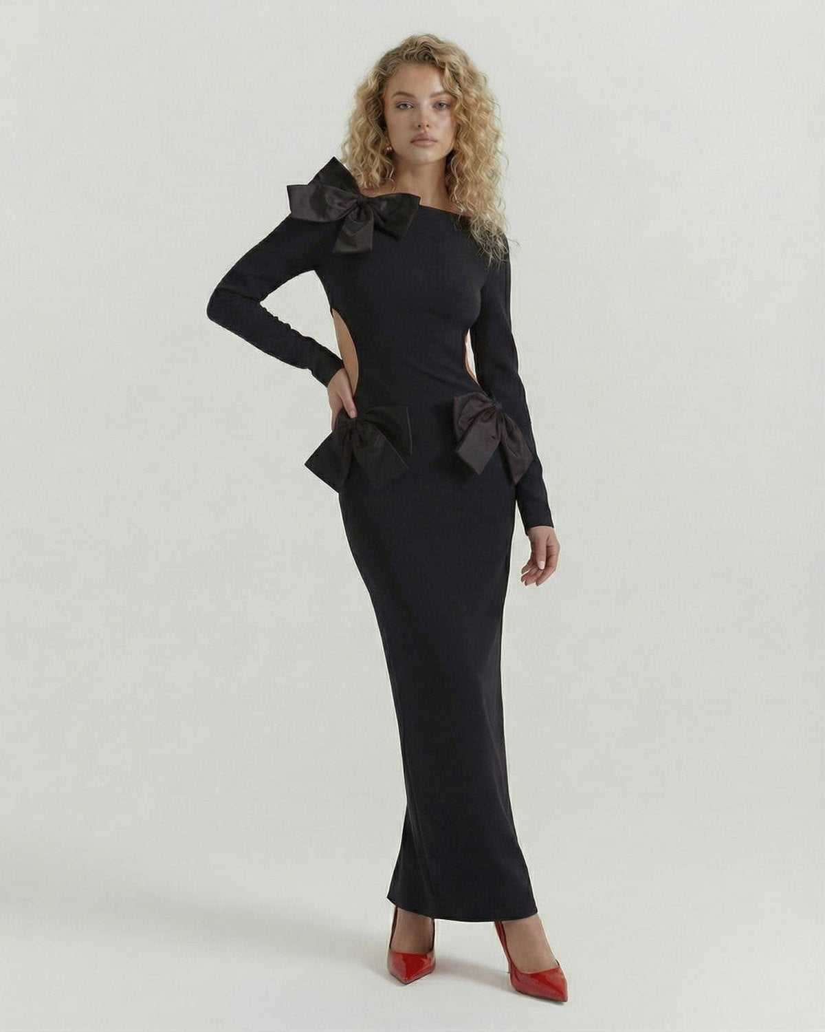 Noir Maxi Dress by Lauven, featuring sleek black design, open back, and elegant bow details for modern sophistication.