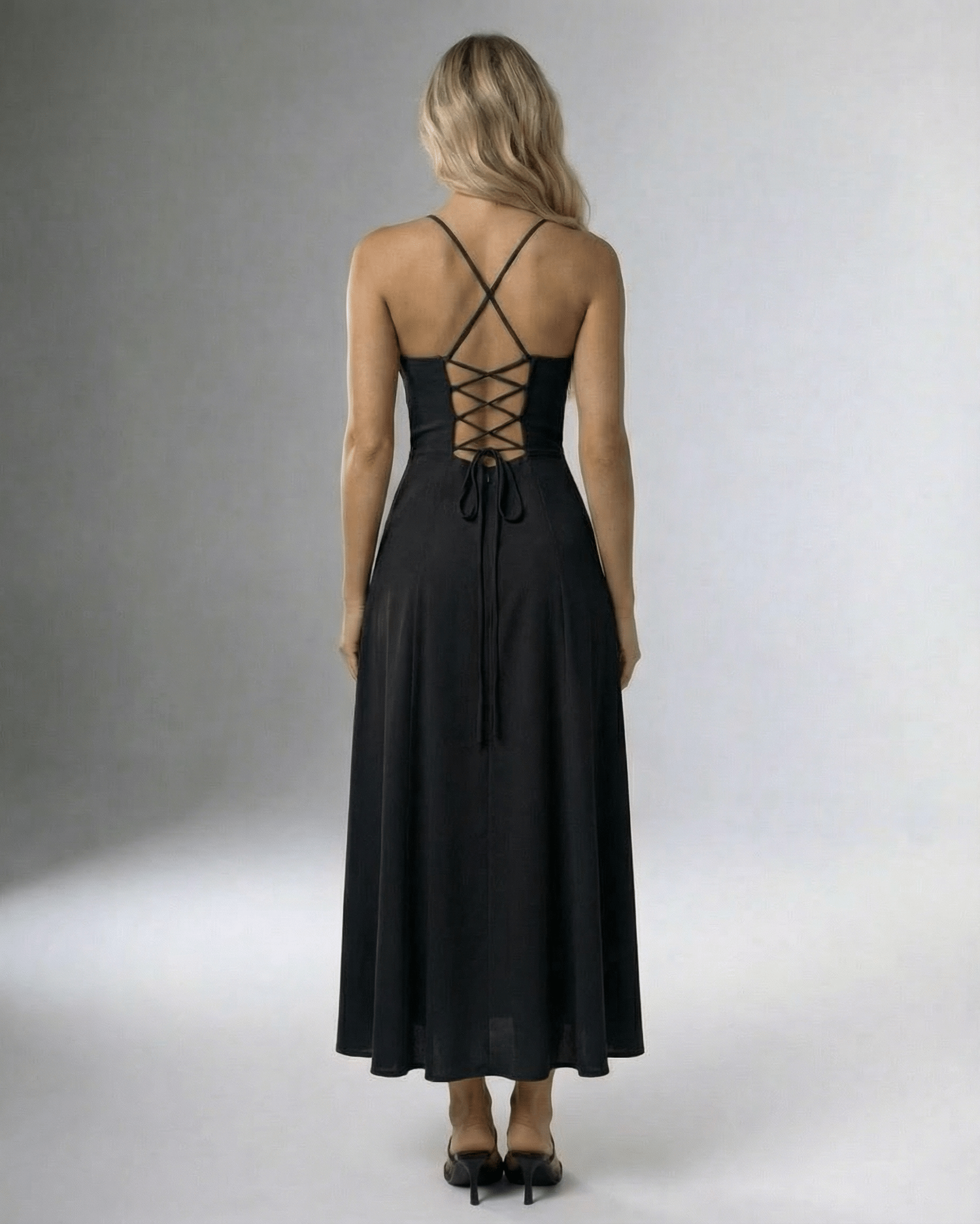 Noir Midi Dress by Lauven featuring a lace-up back and high slit, perfect for elegant evenings.