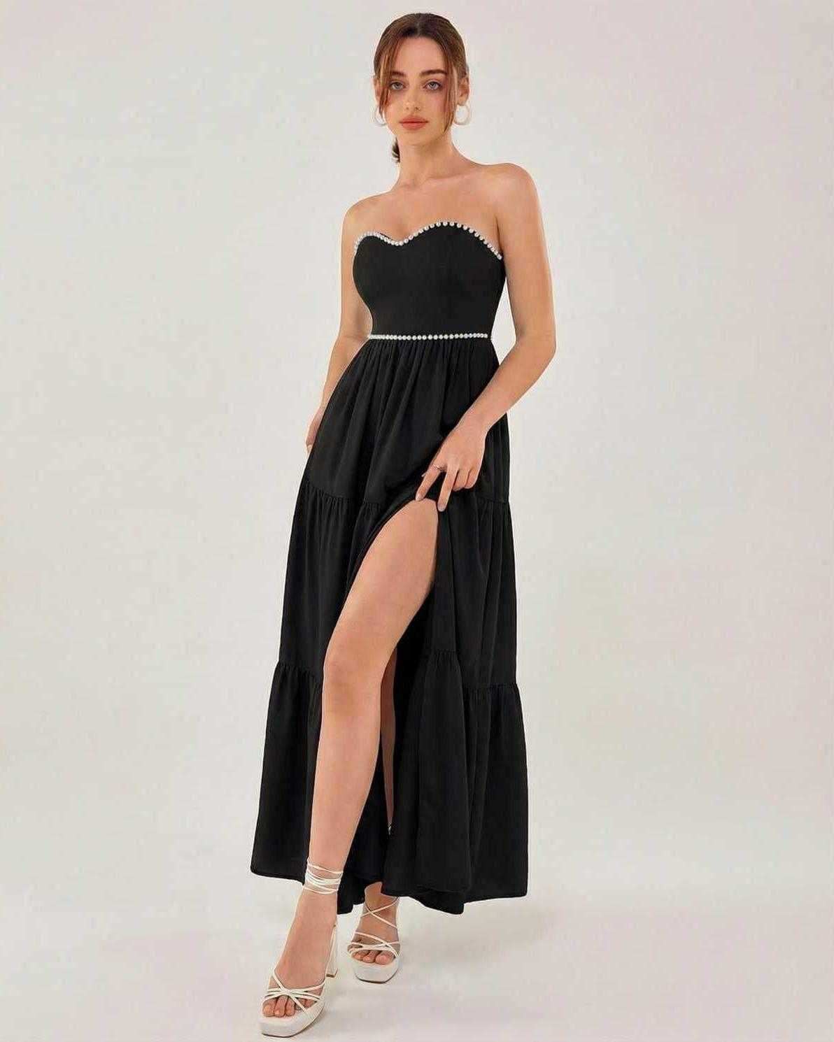 Lauven Noir Midi Dress showcasing a strapless black design with a slit, perfect for refined occasions.