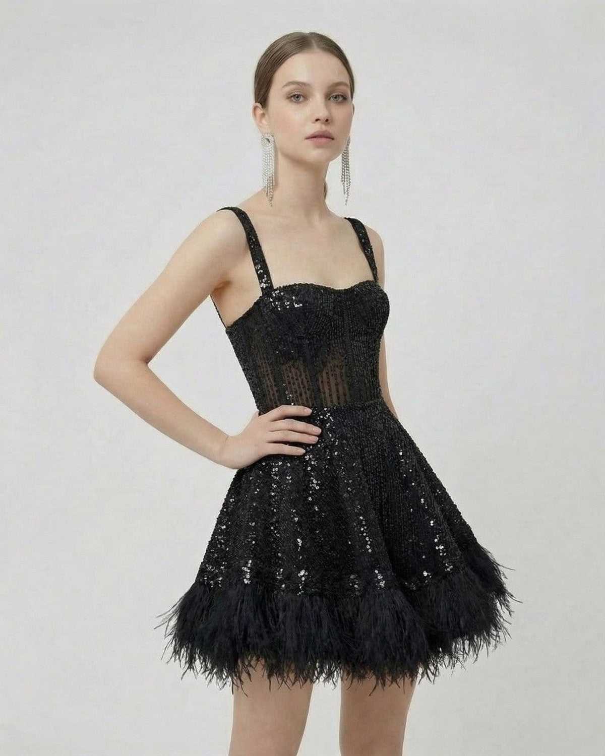 Noir Mini Dress by Lauven, a black sequin A-line mini dress with faux fur hem and spaghetti straps.