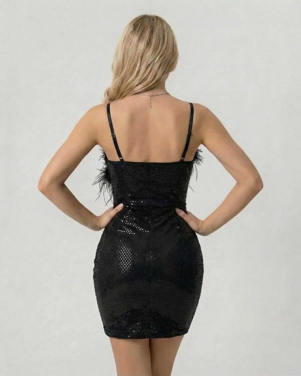 Back view of Noir Mini Dress by Lauven, featuring sequins and faux fur for a chic evening look.