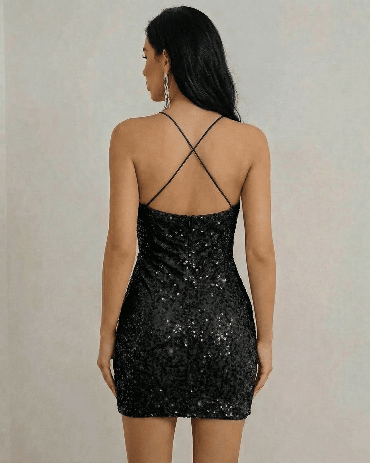 Noir Mini Dress by Lauven, showcasing the back view of a shimmering black sequin halter neck mini dress.