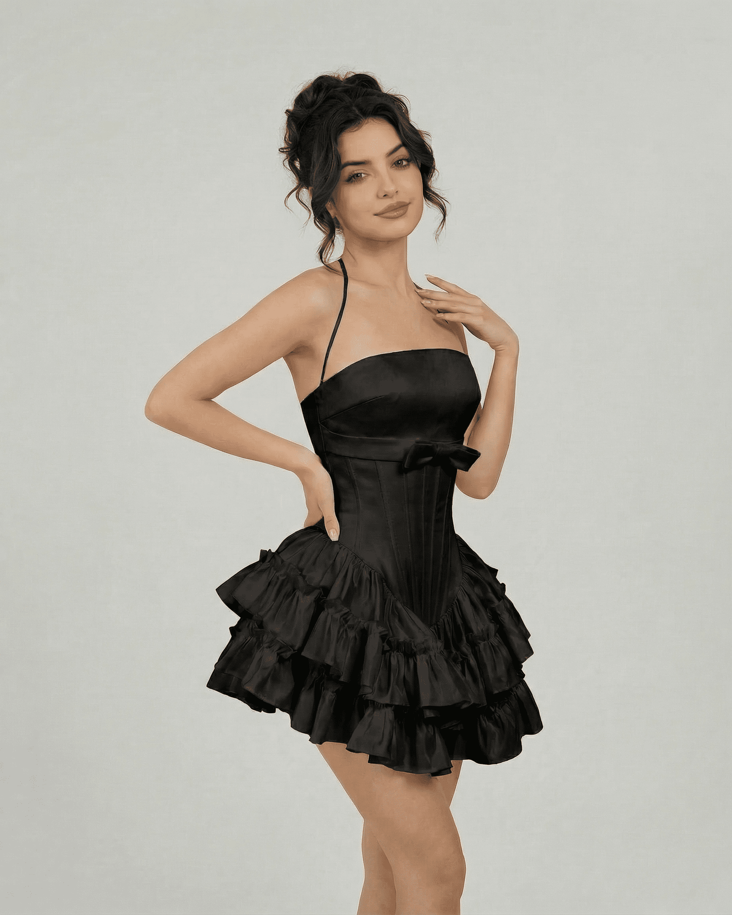 Noir Mini Dress by Lauven - Corset-inspired black tiered mini dress with halter straps and structured silhouette.
