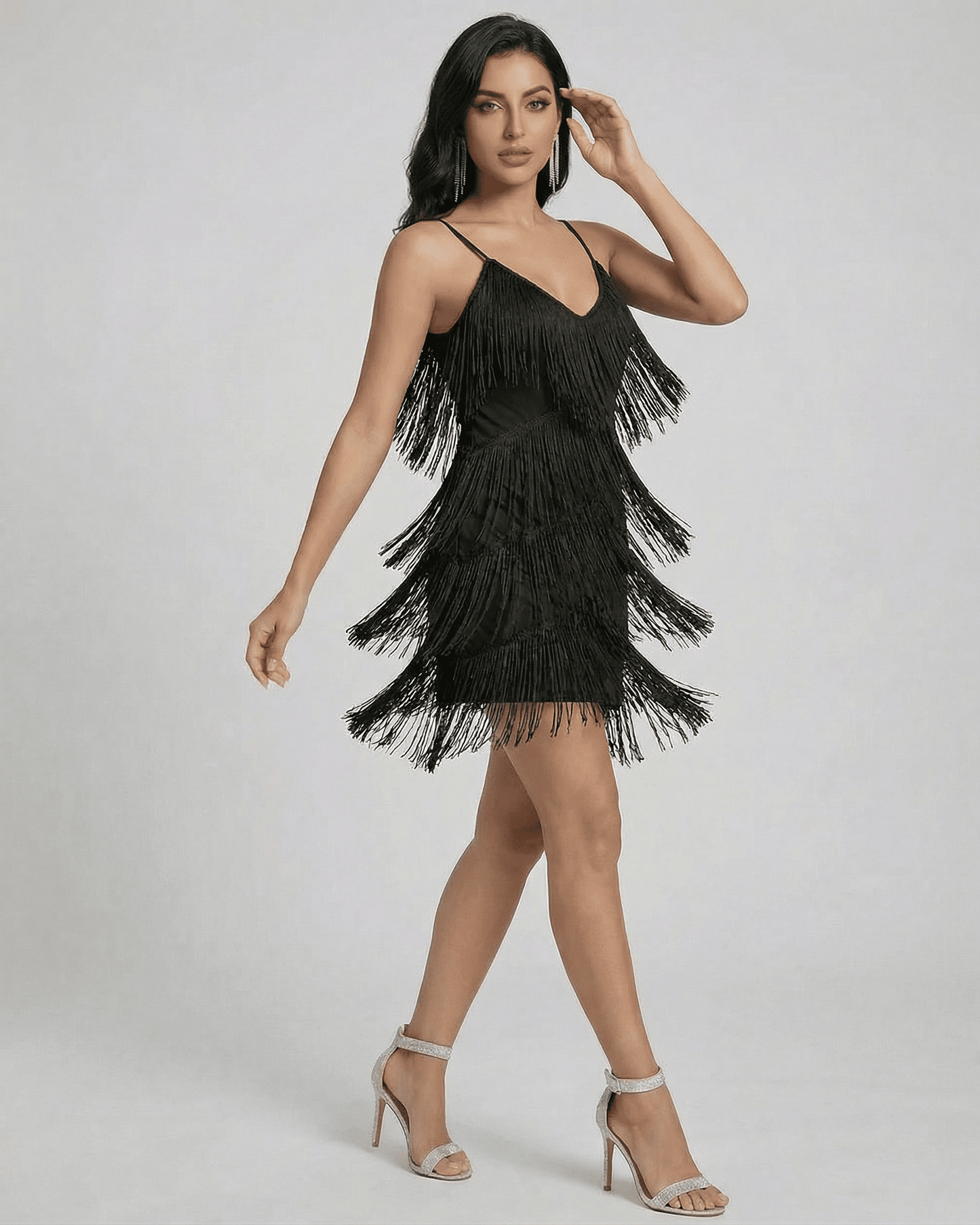Noir Mini Dress by Lauven featuring fringe V-neck and sleeveless design for a modern aesthetic.