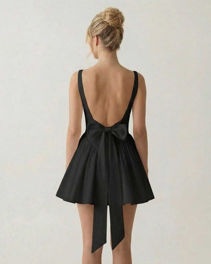 Back view of Noir Mini Dress by Lauven featuring a square neckline and bow detail.