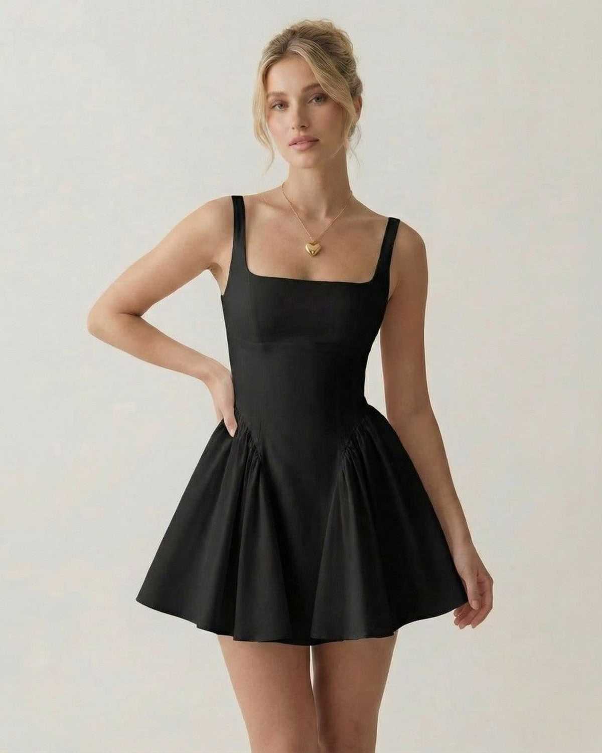 Noir Mini Dress by Lauven - Square neck backless design with bow detail, showcasing a refined silhouette.