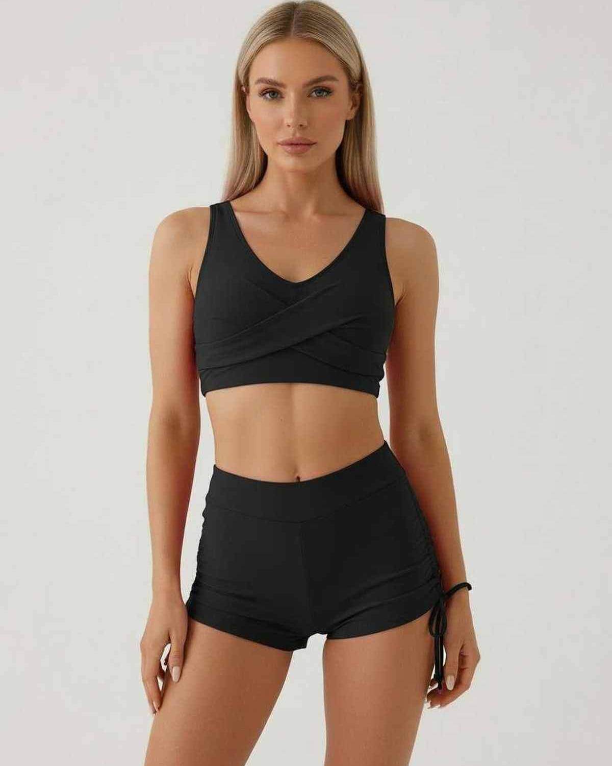 Noir Set by Lauven - Elegant black women's two-piece set with sleeveless crop top and high waist shorts.