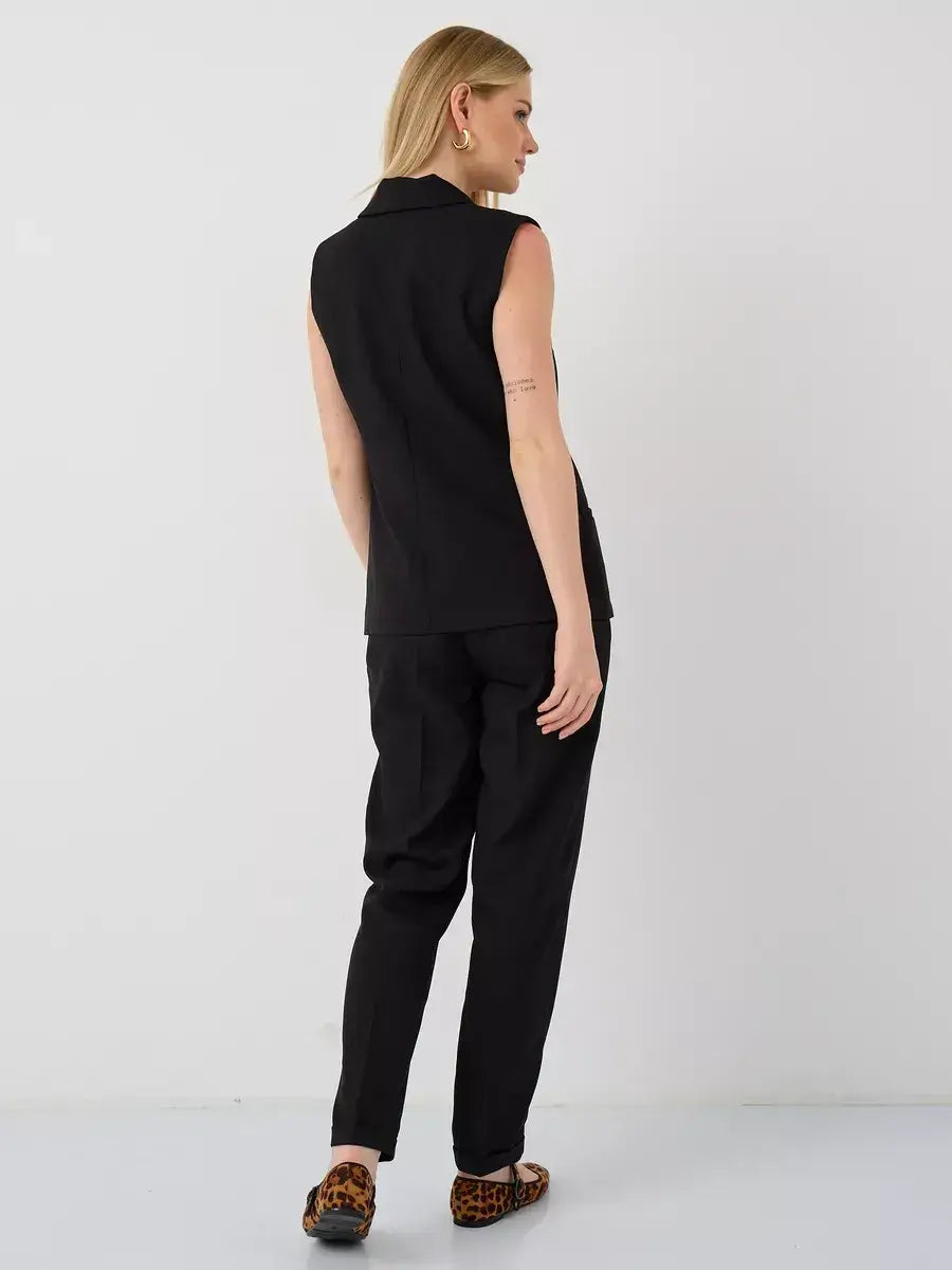 Noir Suit Set by Lauven, featuring a sleeveless black vest and high-waist pants, showcasing a sophisticated look.