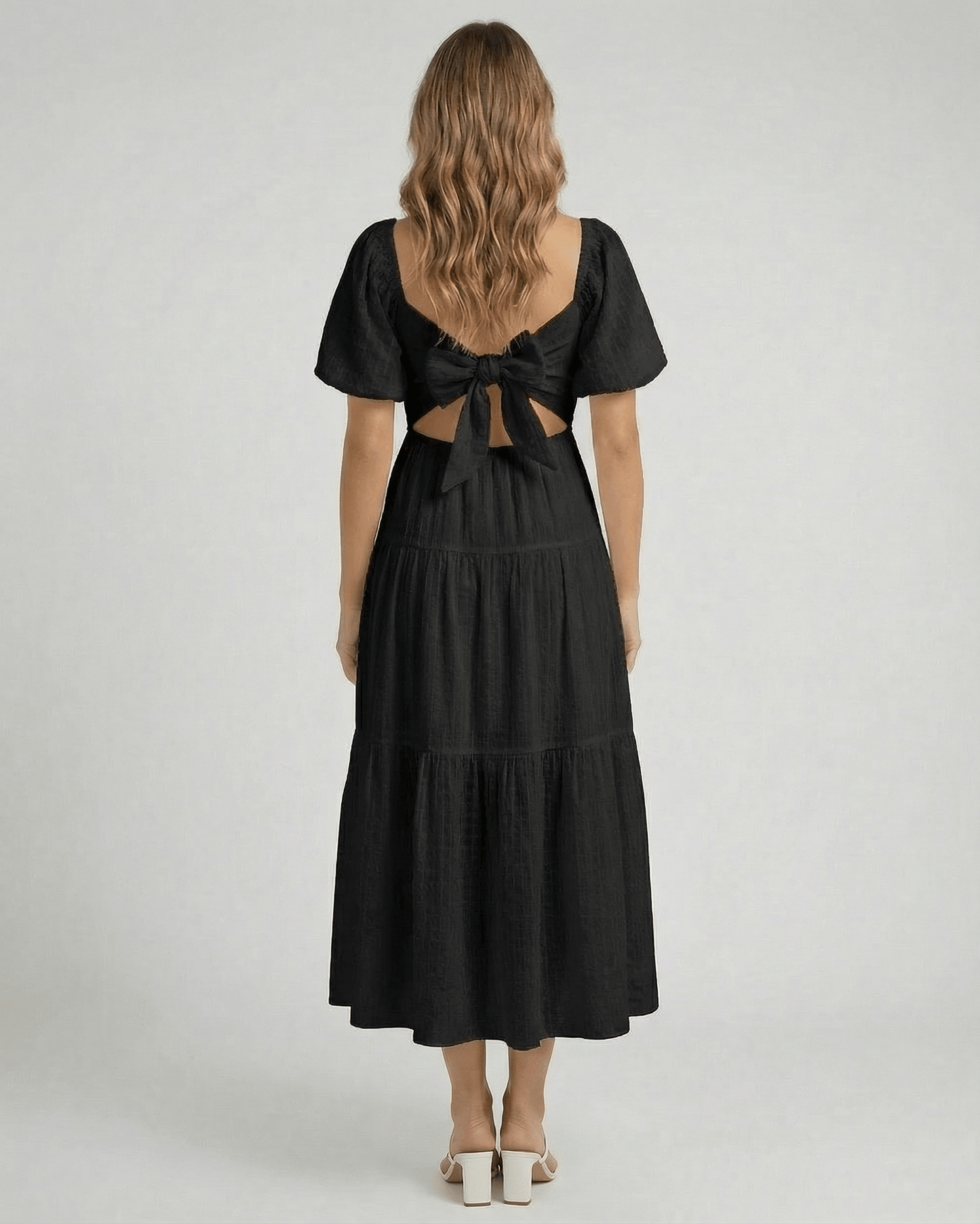 Back view of Noira Midi Dress by Lauven featuring puff sleeves and a bow tie detail.