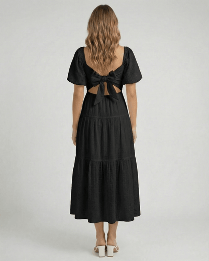 Back view of Noira Midi Dress by Lauven featuring puff sleeves and a bow tie detail.