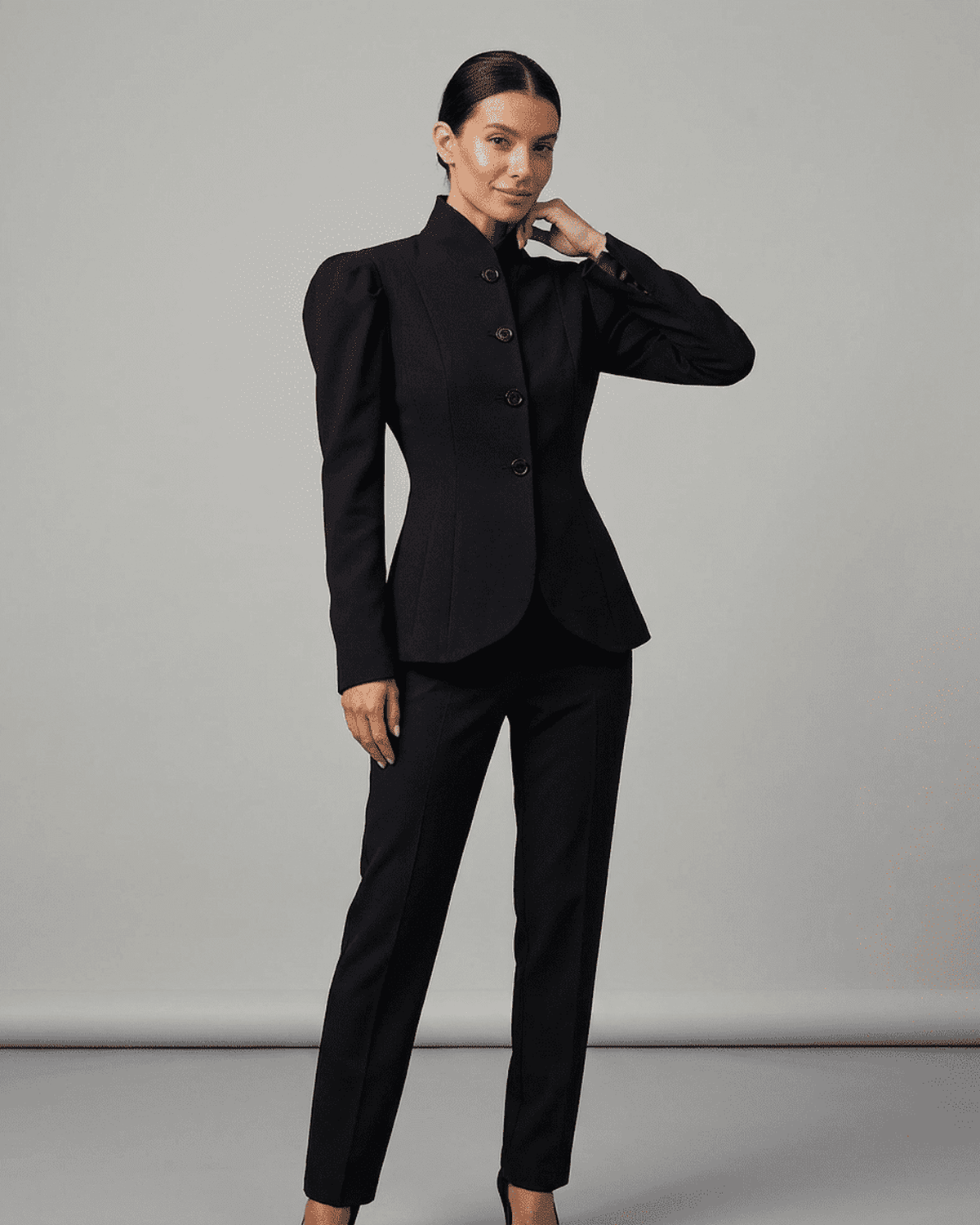 Noiré Blazer by Lauven with stand collar and puff sleeves in elegant black tailored design.