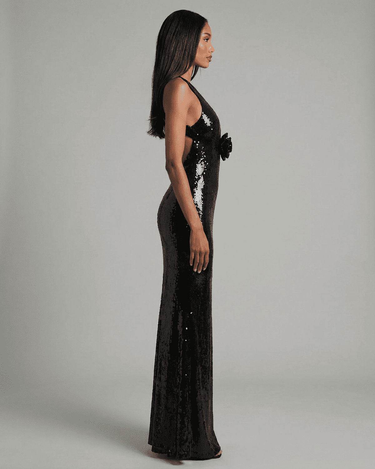 Noiré Maxi Dress from Lauven featuring a backless V-neck silhouette and striking floral sequin detail.
