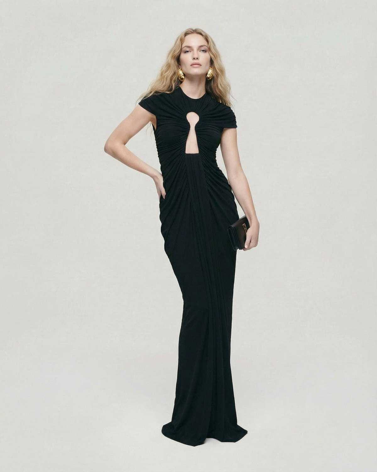 Elegant model wearing Noiré Maxi Dress by Lauven, showcasing black evening dress with ruched keyhole detail.