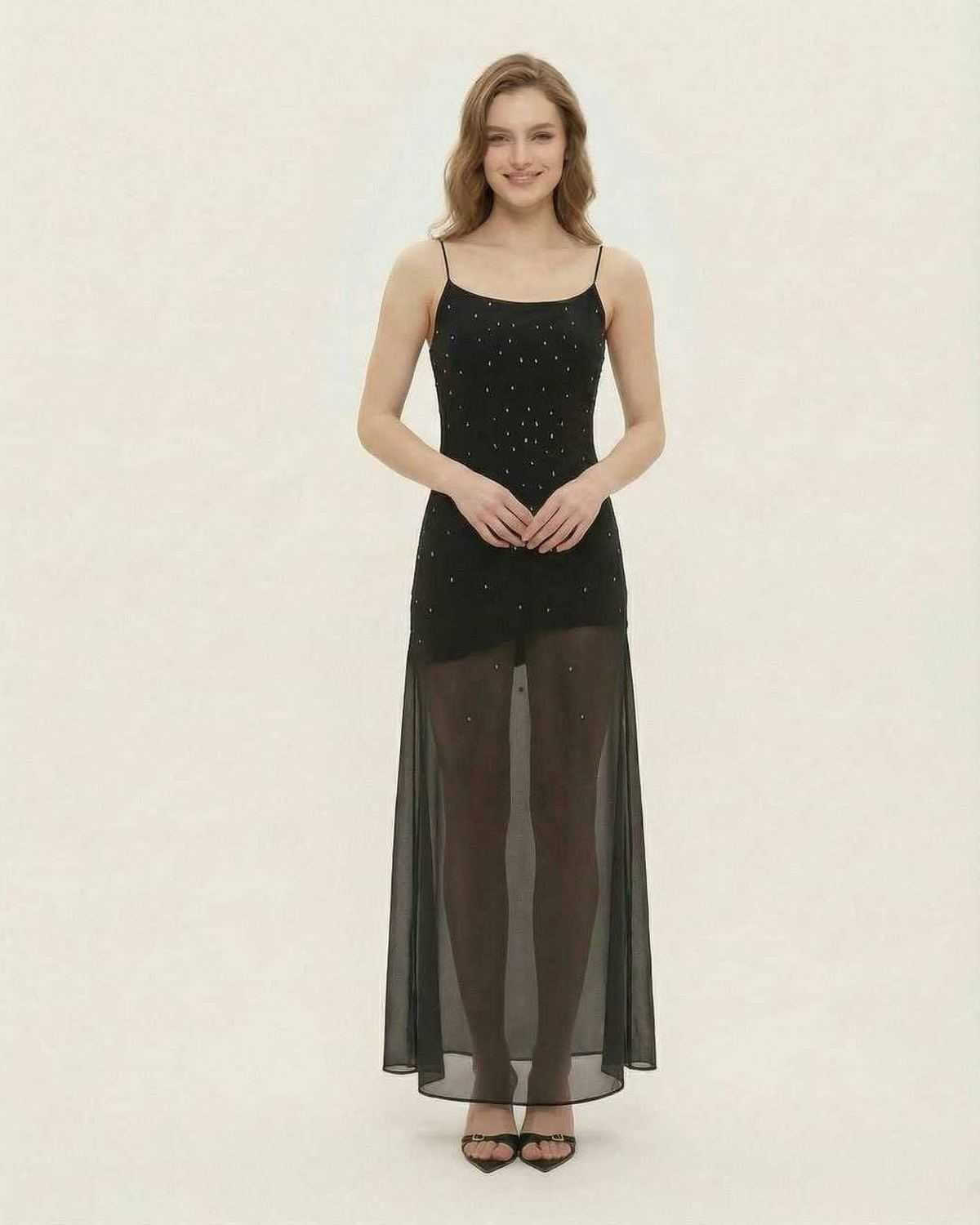 Noire Maxi Dress by Lauven, featuring sheer mesh A-line silhouette and fine glitter detail.