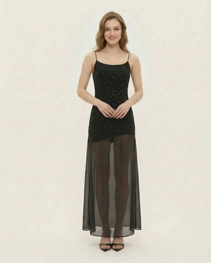 Noire Maxi Dress by Lauven, featuring sheer mesh A-line silhouette and fine glitter detail.