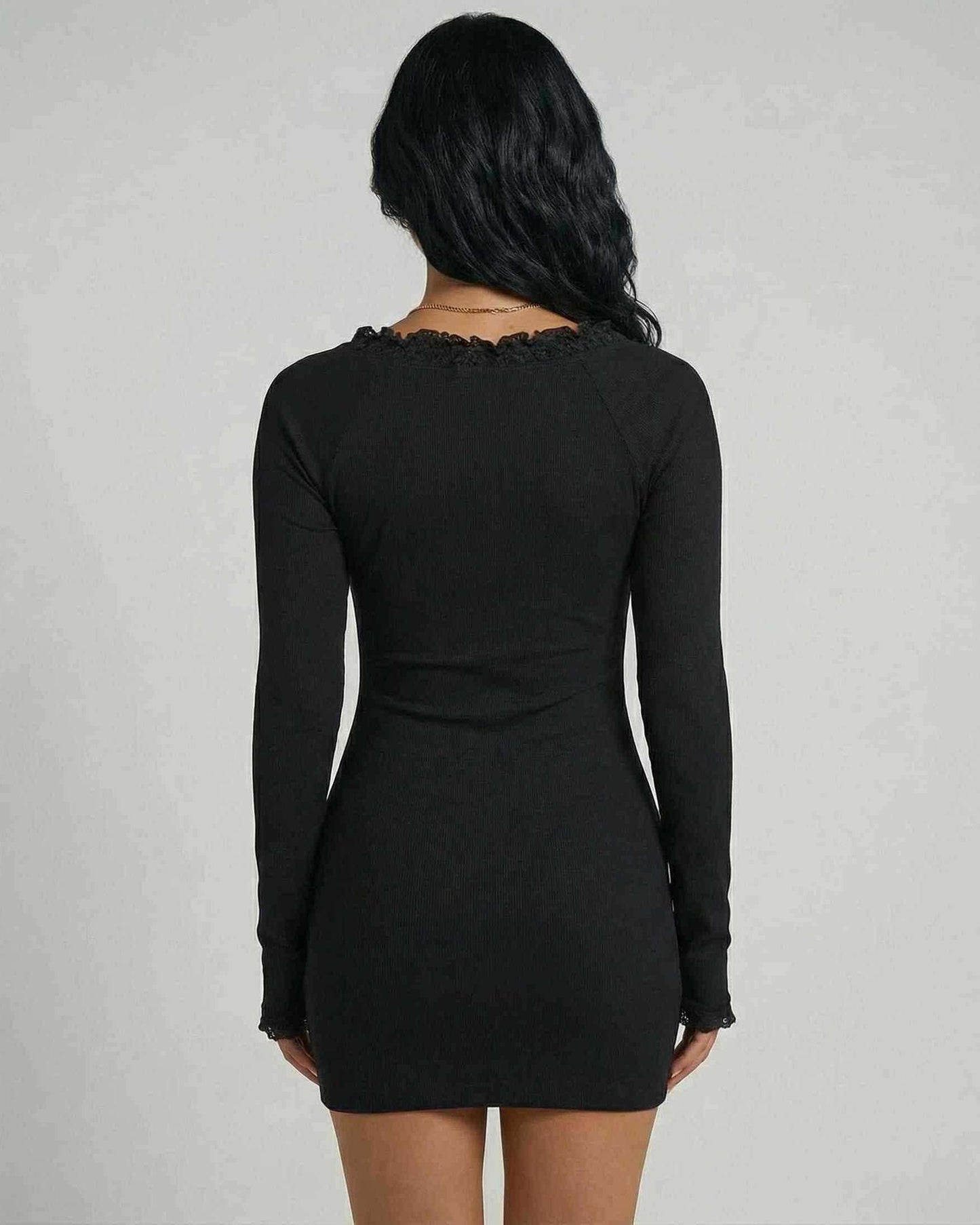 Back view of Noiré Mini Dress by Lauven, showcasing the lace trim and slim fit silhouette in classic black.