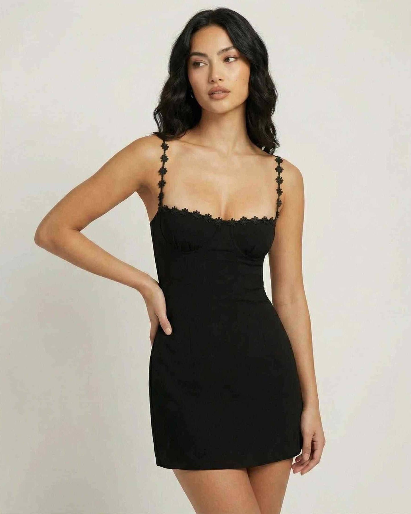 Noiré Mini Dress by Lauven, featuring a black square neck and spaghetti straps with floral trim.