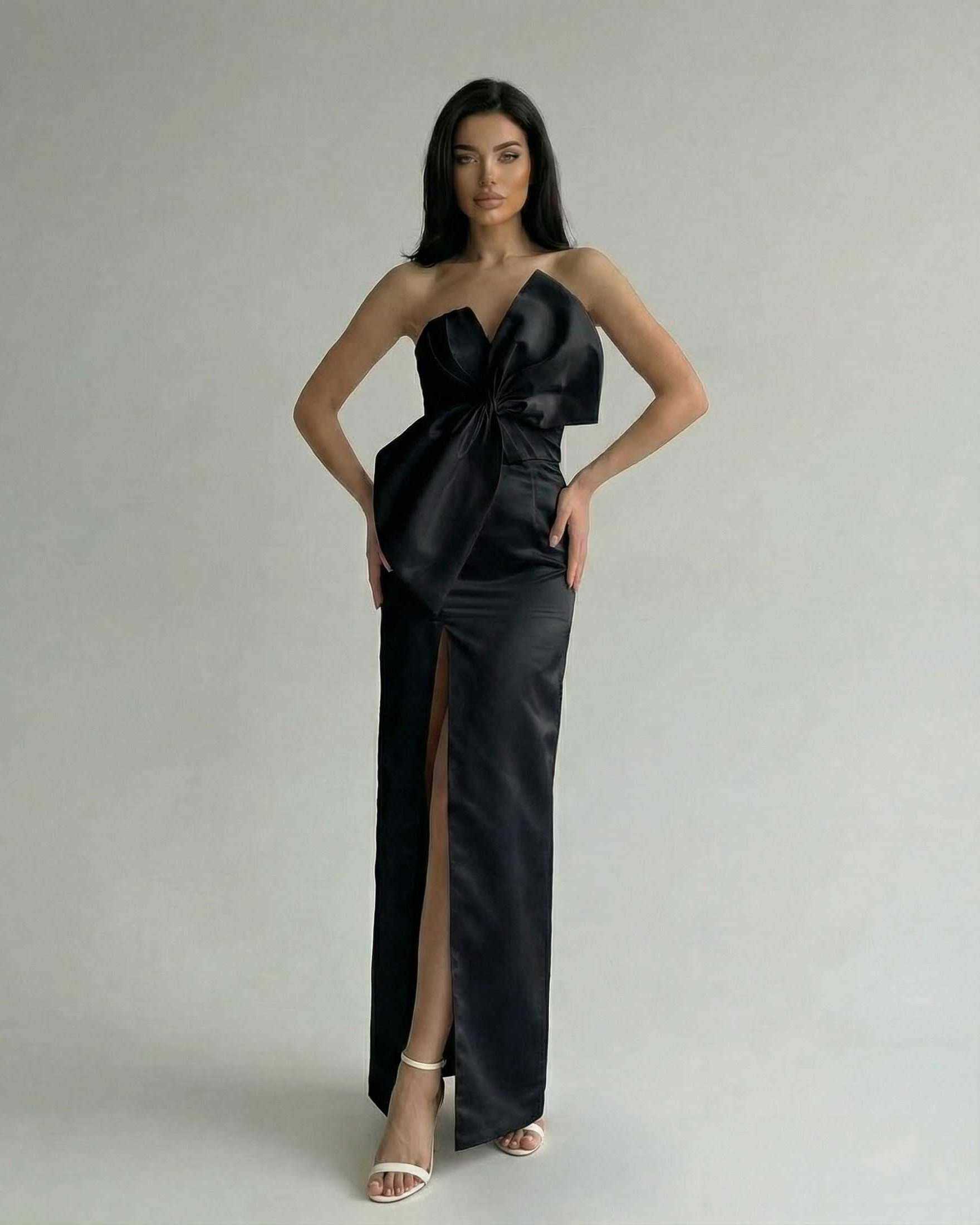 Noirelle Maxi Dress by Lauven, black strapless satin sheath with front slit, featured on a model in an elegant pose.