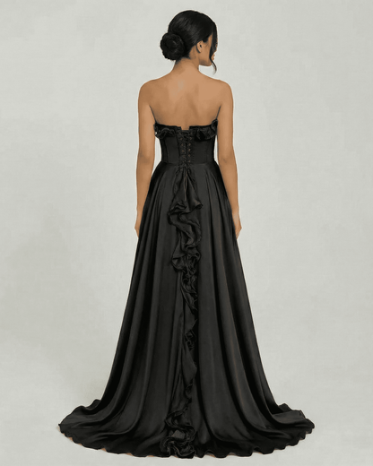 Noirelle Maxi Dress by Lauven - Elegant strapless black dress with ruffle detail and flowing silhouette.