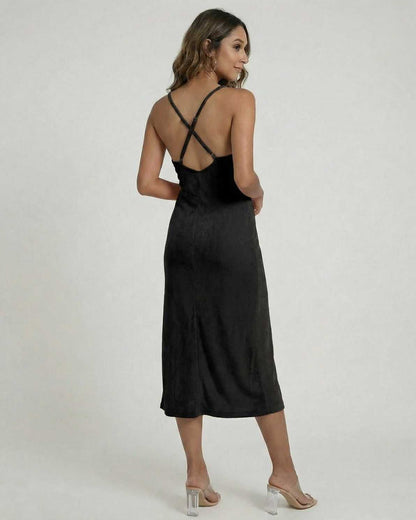 Model wearing the Lauven Noirelle Midi Dress, showcasing the cowl neck and cross-back design.