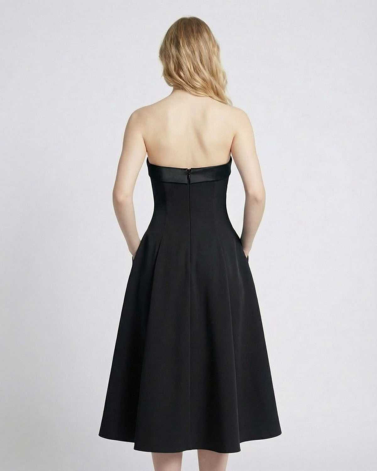 Noirelle Midi Dress by Lauven, strapless design highlighting the elegant back and high-waist silhouette.