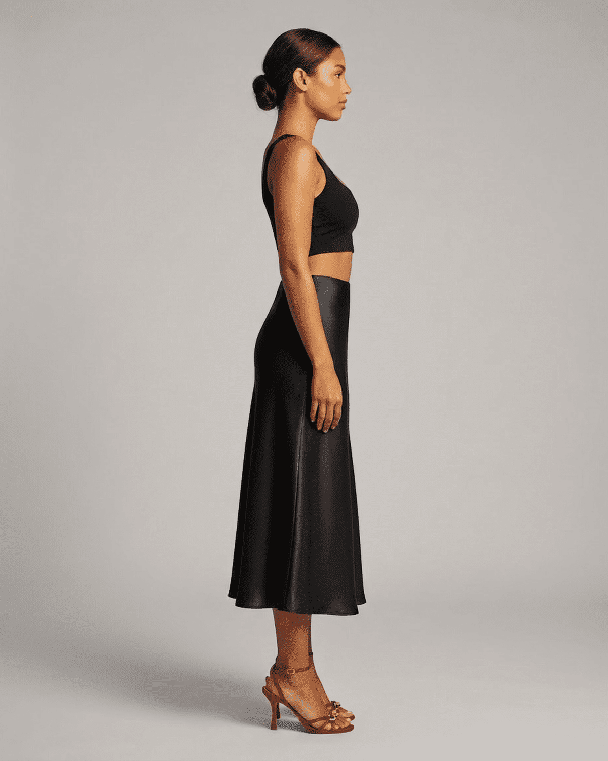 Noirelle Midi Skirt by Lauven, satin mermaid midi skirt in classic black, showcasing timeless elegance.