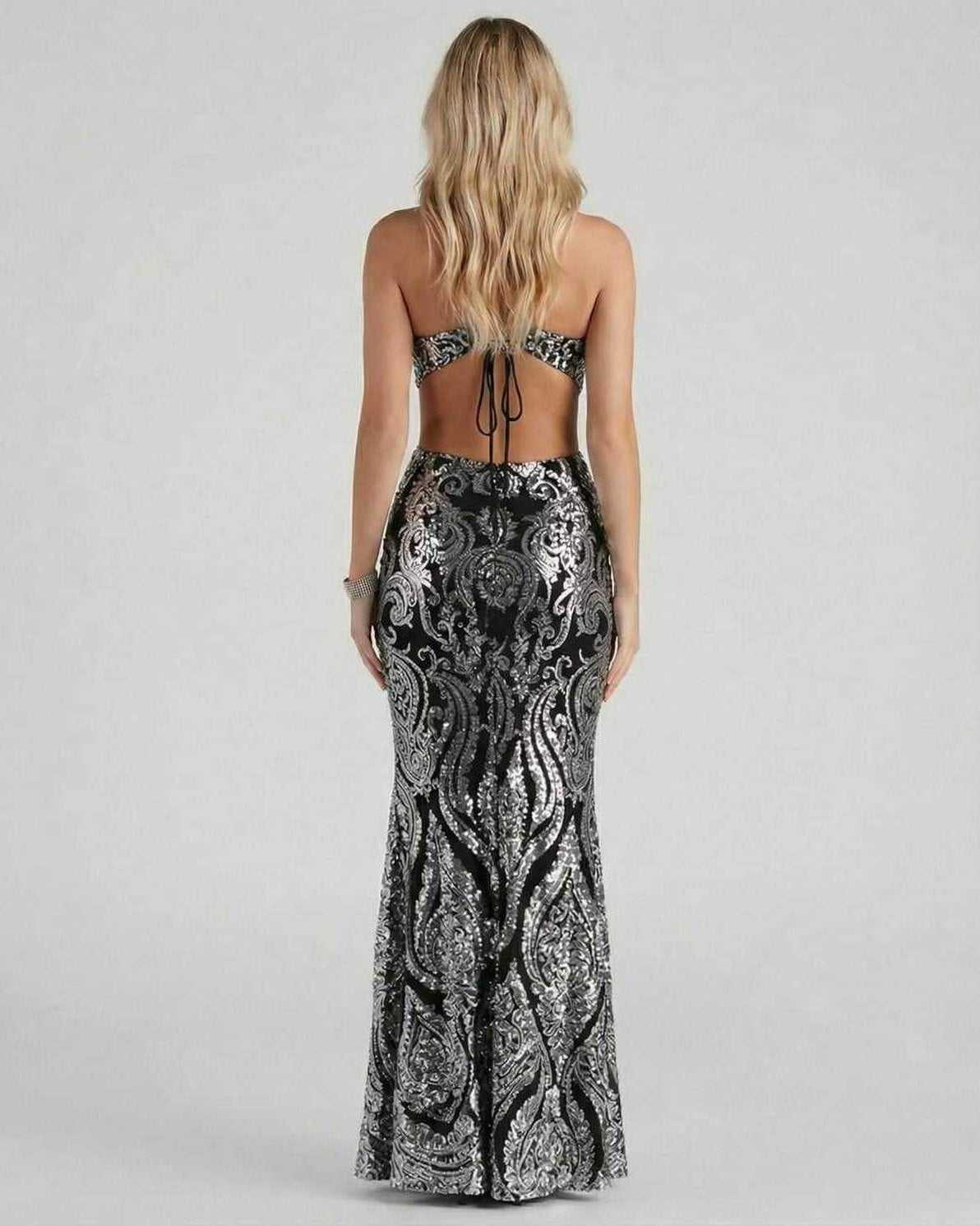 Noirine Maxi Dress by Lauven featuring a stunning back design and silver sequin detailing for an elegant evening look.