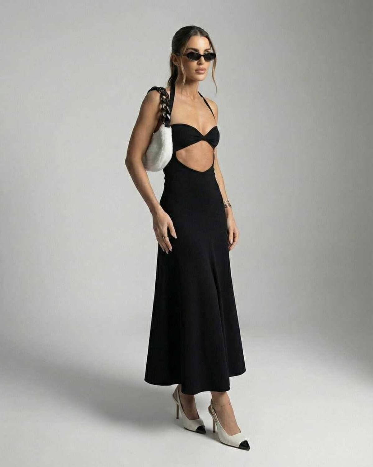 Nova Midi Dress by Lauven – Elegant cutout halter dress showcasing a slim fit silhouette.