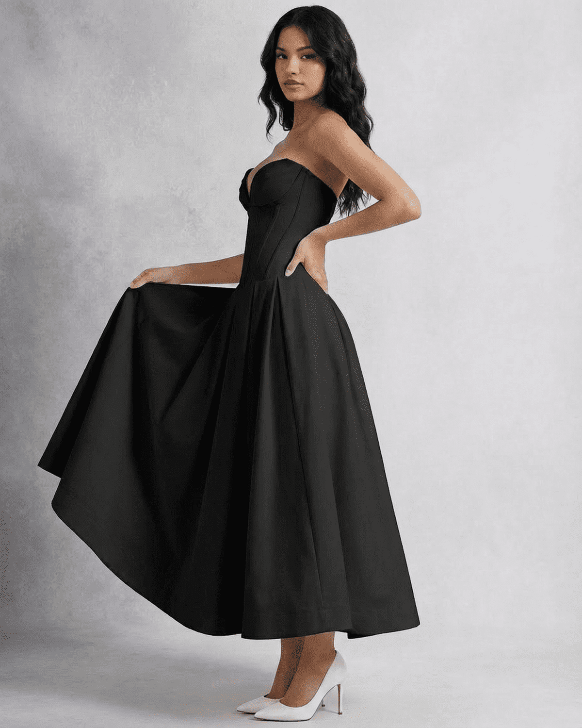 Nova Midi Dress by Lauven, showcasing a sleek strapless corset design with a flowing A-line skirt in black.