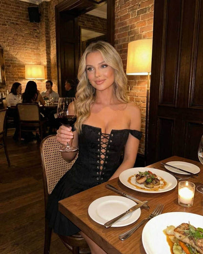 Nova Mini Dress by Lauven worn at a restaurant, showcasing an off-shoulder style and sleek design.