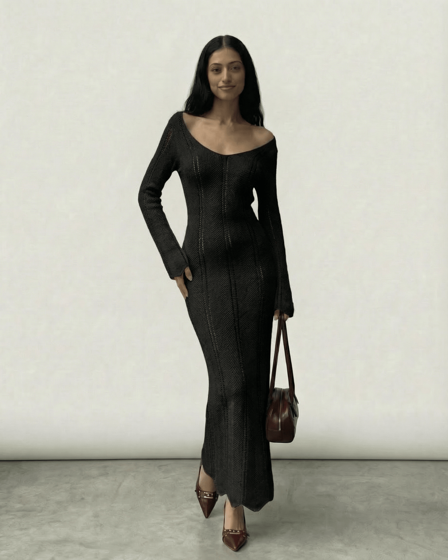 Model wearing the Nyra Maxi Dress by Lauven, a ribbed bodycon maxi with V-neck and long sleeves.