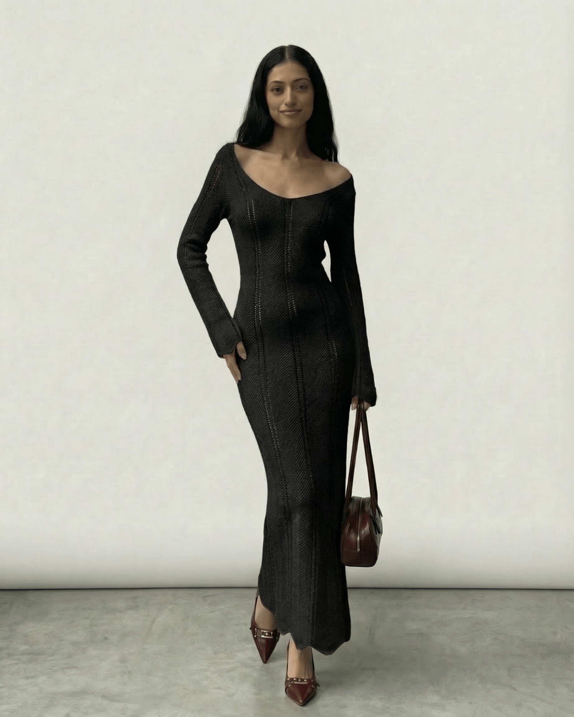 Model wearing the Nyra Maxi Dress by Lauven, a ribbed bodycon maxi with V-neck and long sleeves.