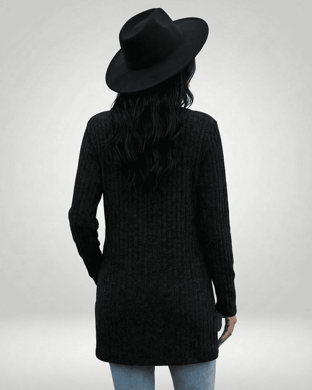 Back view of a woman wearing the Nyx Cardigan by Lauven, showcasing a longline style and textured knit.