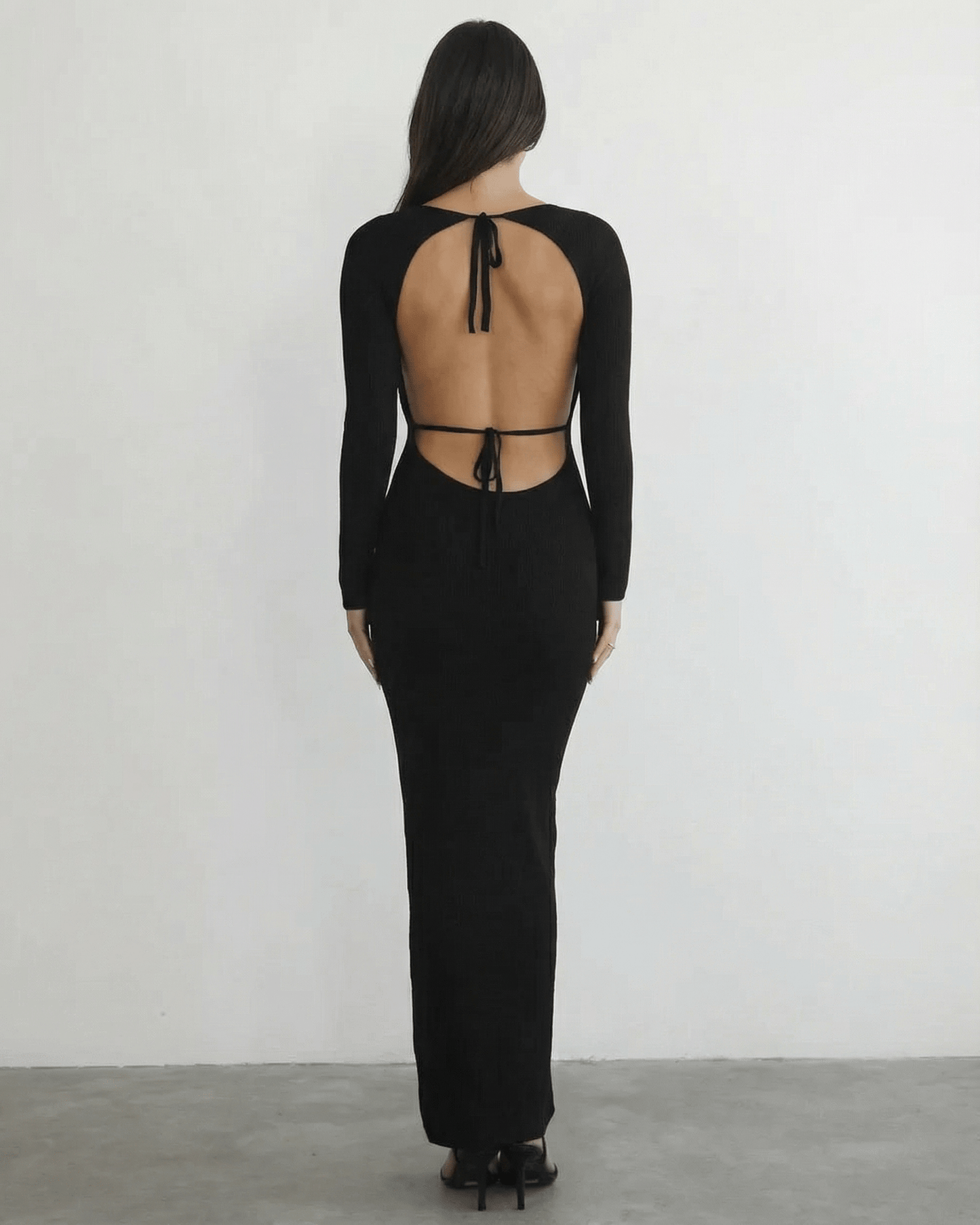 Nyx Maxi Dress from Lauven, showcasing the elegant back detail and long sleeve design.