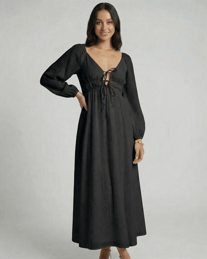 Nyxara Maxi Dress by Lauven features a black V-neck, empire waist, and fluid ankle-length design, perfect for modern wardrobes.