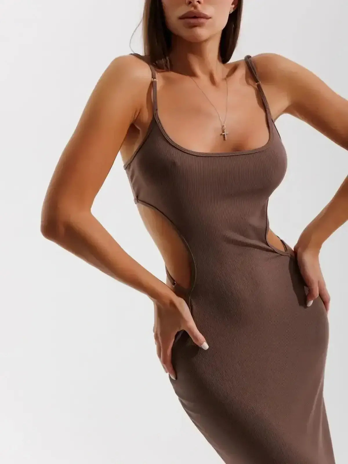 Model wearing the Obsidian Curve Midi Dress by Lauven, showcasing daring cut-outs and bodycon silhouette.