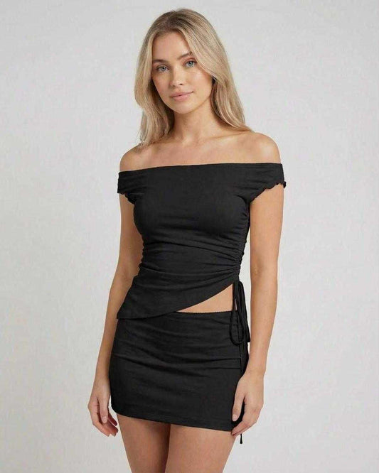 Onyx Mini Dress by Lauven - Asymmetric off-shoulder design and high waist mini skirt in sleek black.