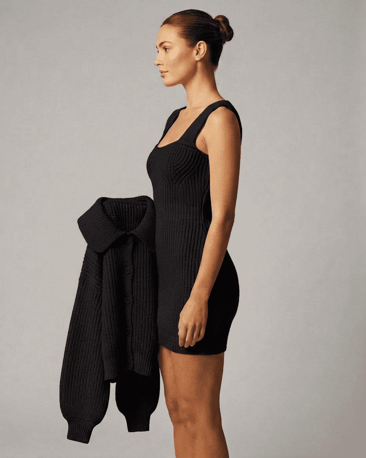 Onyx Mini Dress by Lauven featuring a fitted black bodycon design with sleeveless cami straps and a stylish cardigan.