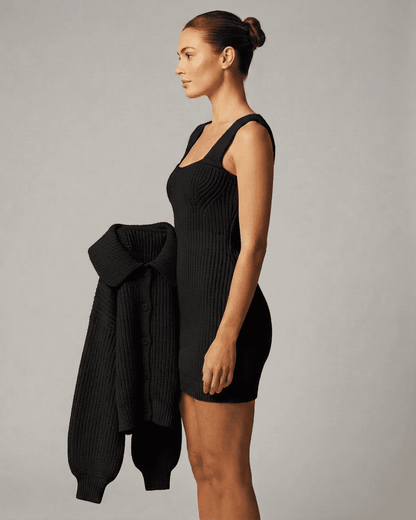 Onyx Mini Dress by Lauven featuring a fitted black bodycon design with sleeveless cami straps and a stylish cardigan.