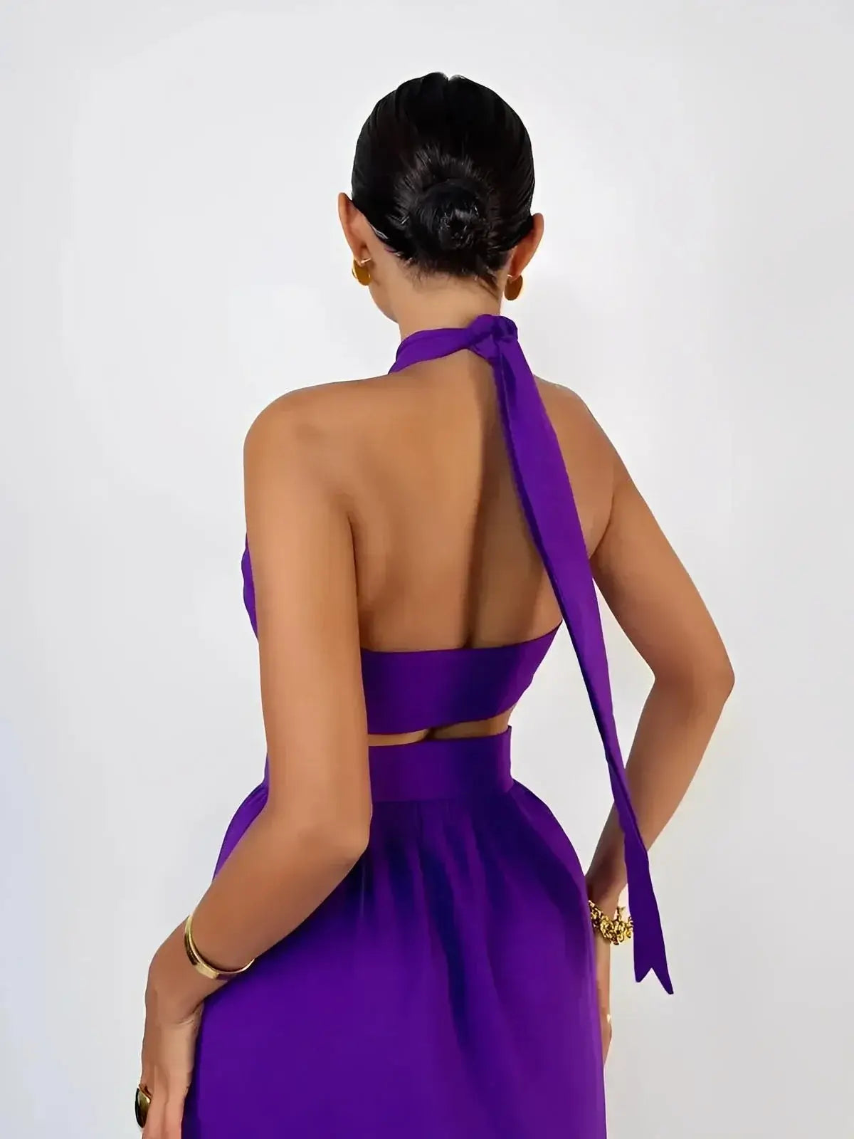 Orchid Drape Set by Lauven featuring a back view of a purple halter top and flowing high-waisted skirt.