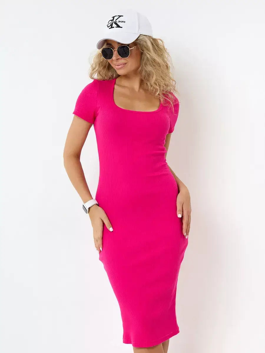 Model wearing Orchid Midi Dress in vibrant fuchsia by Lauven, complemented with sunglasses and a cap.