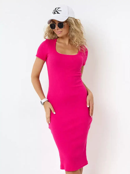 Model wearing Orchid Midi Dress in vibrant fuchsia by Lauven, complemented with sunglasses and a cap.