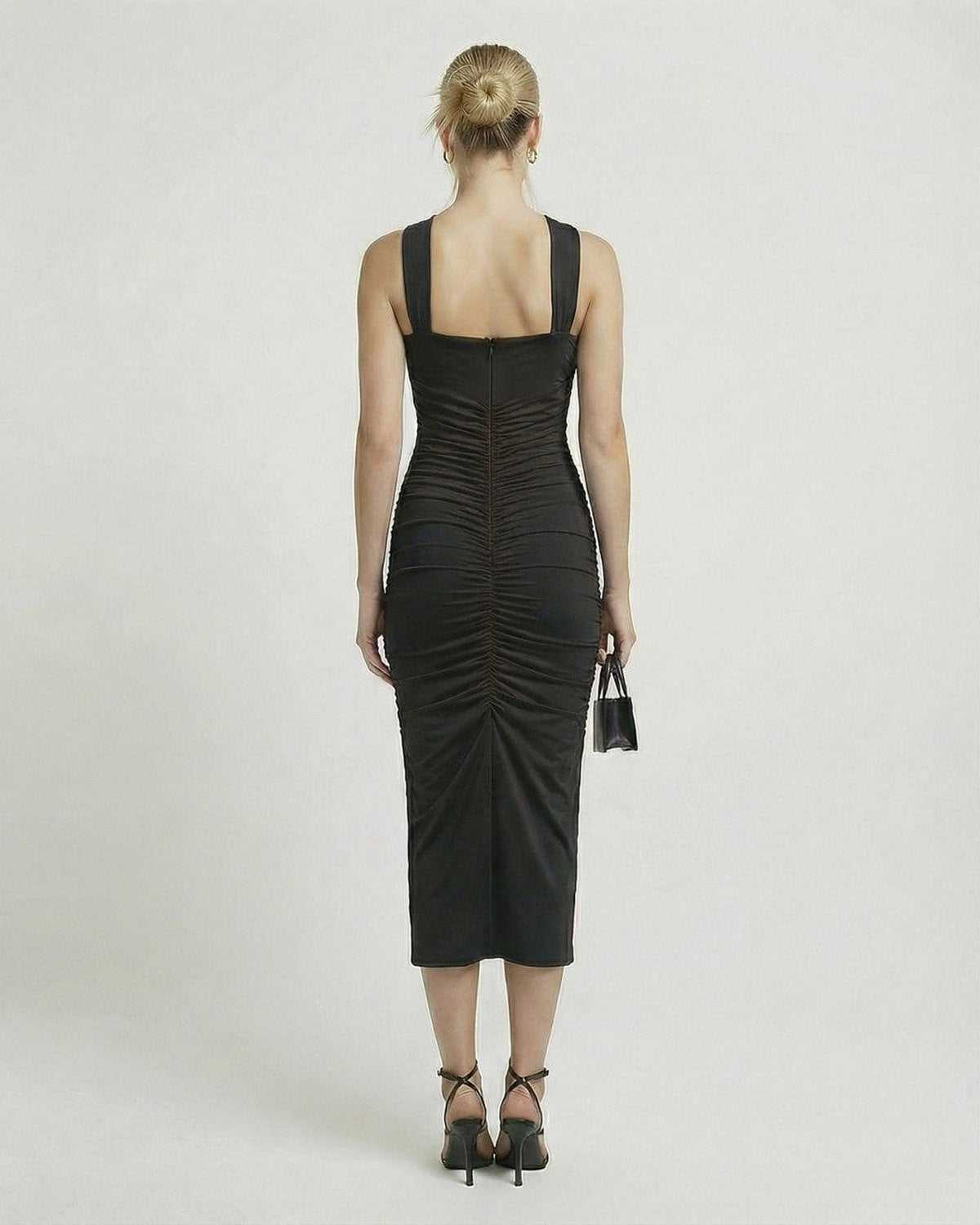 Orion Midi Dress from Lauven, showcasing the back view with sleek black sheath and ruched detailing.
