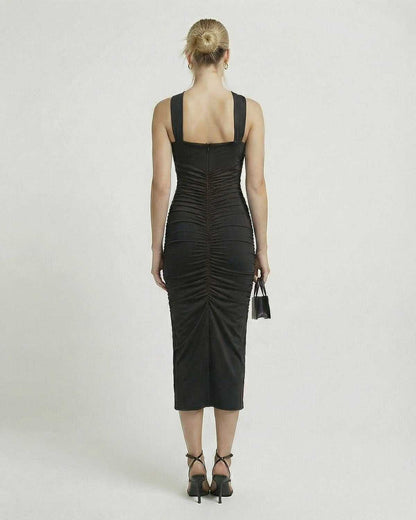 Orion Midi Dress from Lauven, showcasing the back view with sleek black sheath and ruched detailing.