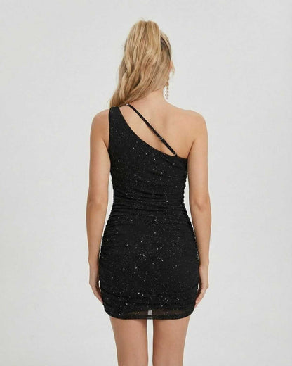 Orion Mini Dress by Lauven, asymmetrical one-shoulder design with chain detail, showcasing a sophisticated black silhouette.